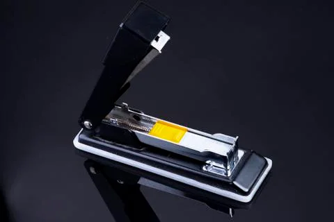 Office tacker opened with tacker staples with yellow plastic Stock Photos