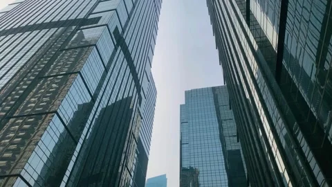 Office tall building. Low angle view of skyscrapers office building in cent.. Stock Footage 314104364