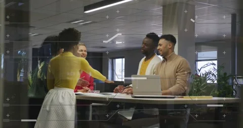Office team gathering around table woman in yellow initiating hand stack over Stock Footage 331273046