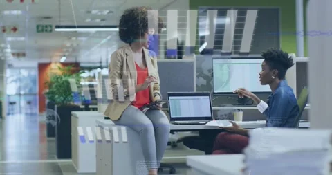 Office team tapping tablet and pointing laptop causing overlay bars showing data Stock Footage 321549891