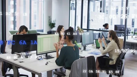 Office team wearing headsets taking calls, gesturing and typing while data codes Stock Footage 333494261