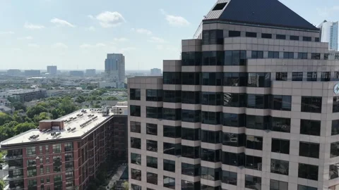 Office tower and apartment blocks on McKinney Avenue in Uptown Dallas aerial Stock Footage 342476035