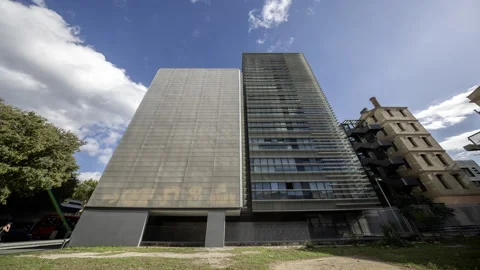 Office Tower in barcelona with passing clouds Stock Footage 318587830