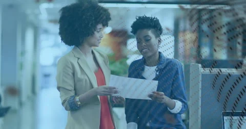In office, two women discussing document with data processing animation overlay Stock Footage 303607749