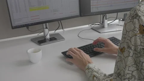 Office Typing while drinking Coffee Video stock 220603526