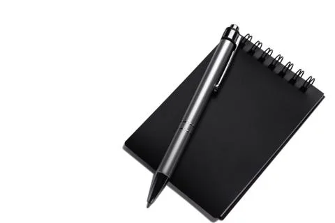 Office on a white background. Notepad, pen. Business and financial concept. Stock Photos