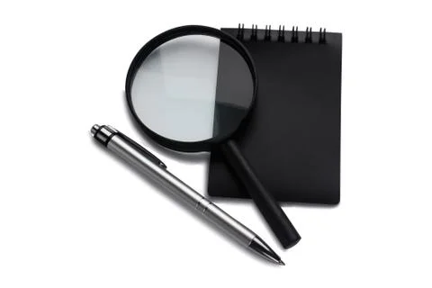 Office on a white background. Notepad, pen and magnifiert. Business and finan Stock Photos