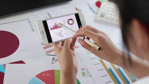 Office white collar worker is analyzing financial statements and data charts Stock Footage 273860890