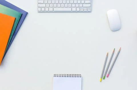 Office White Table with Computer Keyboard Mouse Color Pencils Booklets and other Stock Photos