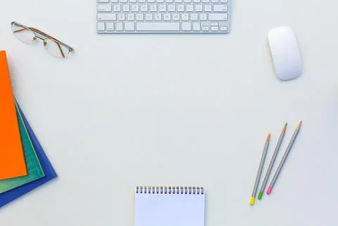 Office White Table with Computer Keyboard Mouse Color Pencils Booklets and other Stock Photos