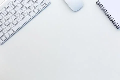 Office White Table with Computer Keyboard Mouse and Notepad Top View Stock Photos