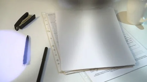 Office white table with papers and pens. dress up glasses Video stock 83467406