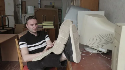 Office Woker Working Old Computer Has Put His Feet Up On The Table Stock Footage 316149998