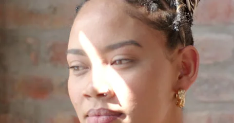 In office, woman focused on coding project, natural light highlighting face Stock Footage 311495432