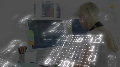 Office woman typing, binary overlay appearing and sweeping over desk reacting Stock Footage 333078167