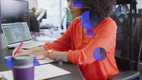 Office woman writing notes while referencing laptop, causing blue business Stock Footage 335465964