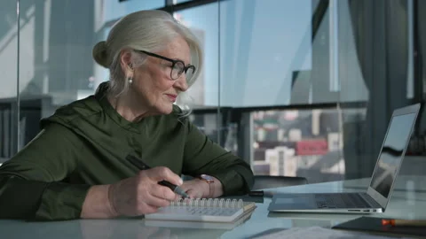 Office Work and Economic Analysis of Grey-Haired Elder Businesswoman. Older Cauc Stock Footage 199479407