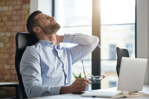 Office work causes health problems and pain in the muscles Stock Photos