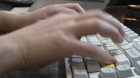 Office work at a computer, programmer typing quickly on a white keyboard, touch Stock-Footage 327213785