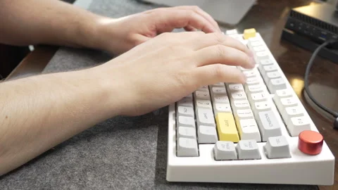 Office work at a computer, programmer typing quickly on a white keyboard, touch Stock Footage 328290257