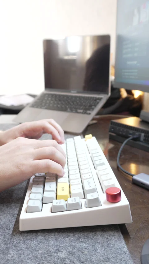 Office work at a computer, programmer typing quickly on a white keyboard, touch Stock Footage 328494448