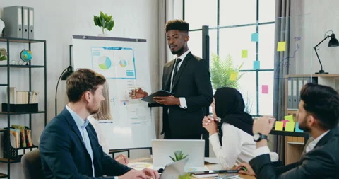 Office work concept where attractive purposeful skilled black-skinned Stock Footage 159675170