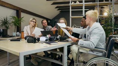Office work concept where satisfied good-looking creative group of multiracial Stock Footage 133604058