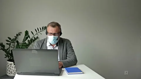 Office work during the covid-19 epidemic. Two colleagues avoid a handshake when Video stock 138425248