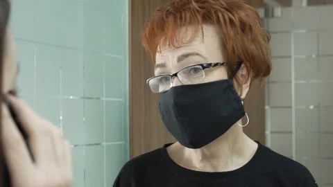 Office work during a pandemic COVID-19. Young business woman talking on Stock Footage 128186567