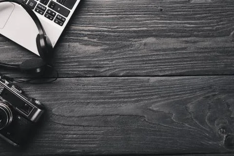 Office work space, notebook, laptop and glasses. On a wooden surface. Top vie Stock Photos