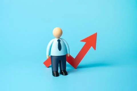 Office worker and red arrow on graph pointing up. Increase in workers' wages. Stock Photos