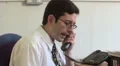 Office worker answers phone HD Footage