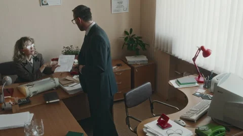 Office Worker Bringing Documents to Colleague and Working on Computer Stock Footage 280258734