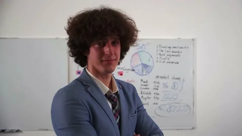 Office worker close-up of a man, in the background a working office process Stock Footage 223376693