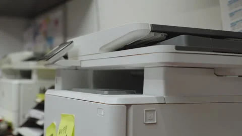Office Worker Collects Printed Documents from Fax Printer Machine Stock Footage 338171642