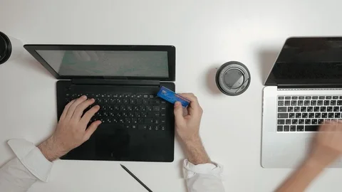 Office worker commits purchase in an online store Stock Footage 98900286