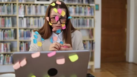 Office worker covered in sticky notes struggles with endless tasks and productiv Stock Footage 341657169
