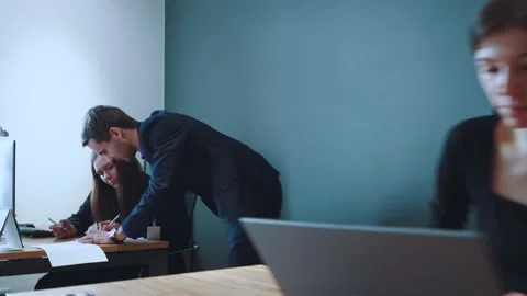 An office worker at a desk with a computer, a person at a computer in the office Stock Footage 237033870