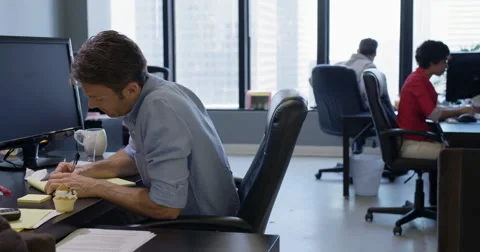 Office worker distracts co-worker to steal cup cake 4K Stock Footage 67261854