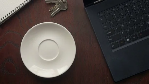 Office worker drinking a coffee while working on laptop computer Stock Footage 74494143