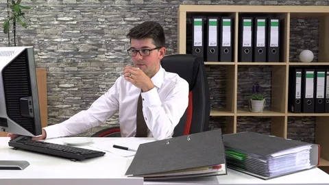 Office worker drinks coffee talking with a client at the workplace. Stock Footage 115723595