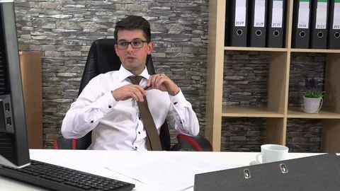 Office worker drinks coffee talking with a client at the workplace. Stock Footage 115877455
