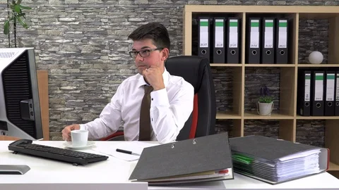 Office worker drinks coffee talking with a client at the workplace. Stock Footage 116417370