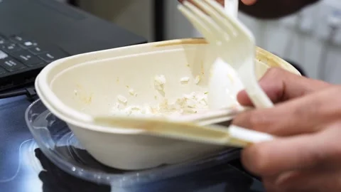 Office Worker Eating Takeaway Lunch at Desk Stock Footage 336597329