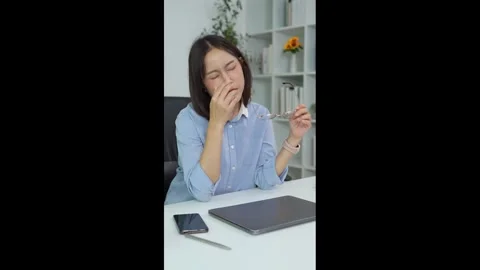 Office worker experiences eye strain during computer work Stock Footage 348329693