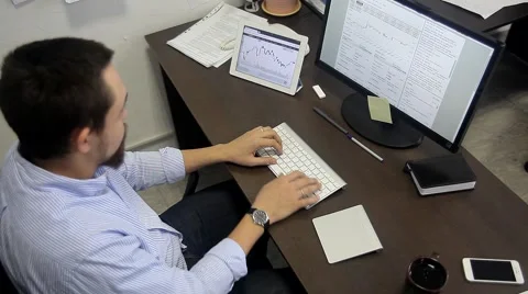 Office Worker Exploring Graphic Exchange Rates. Top View. Stock Footage 47977791