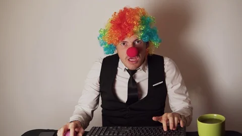 Office worker in the form of a clown wor... | Stock Video | Pond5