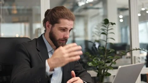 Office worker in formal clothes having video conference on laptop at workplace Stock-Footage 257293922