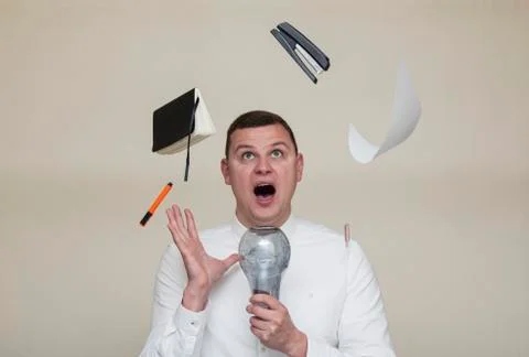 Office worker found an idea for solving a problem, a man with a light bulb Stock Photos