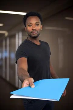 Office worker giving folder document to colleague holding paperwork working o Stock Photos